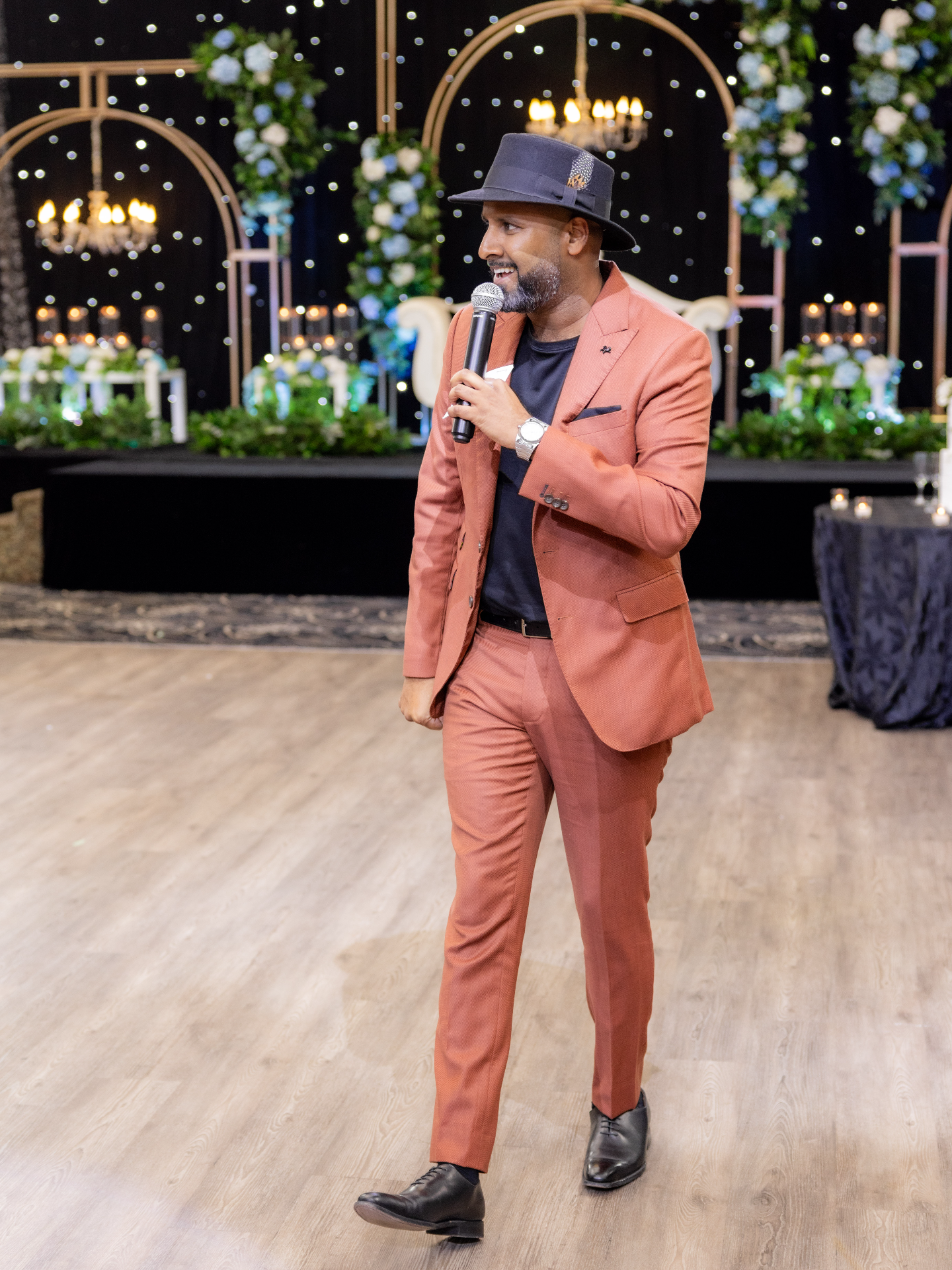 Donovan walking while a mic is in his hand